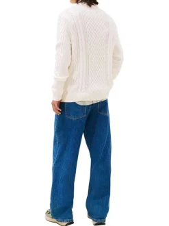 Pull en coton ecru uni avec une coupe droite et logo iconique