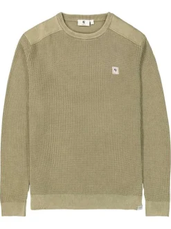 Pull en coton kaki uni en maille tricotée avec patch de la marque