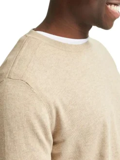 Pull en coton maille piquée beige avec une coupe droite et col rond