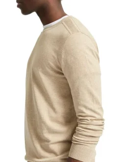 Pull en coton maille piquée beige avec une coupe droite et col rond