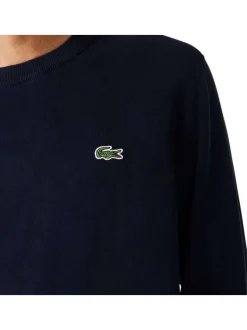Pull en coton marine avec petit logo brodé à la poitrine col rond