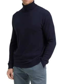 Pull en coton marine uni avec un col roulé et des manches longues