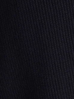 Pull en coton marine uni avec une coupe droite et un col rond