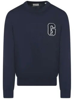 Pull en coton marine uni à coupe ajustée avec un logo brodé sur la poitrine