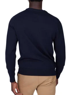 Pull en coton marine uni pourvu d'un col rond et de manches longues