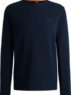 Pull en coton marine uni pourvu d'un col rond et de manches longues