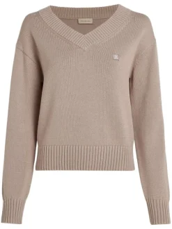 Pull en coton mauve uni avec logo iconique et une coupe droite à col v