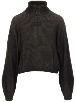 Pull en coton mélangé sapin uni avec une coupe évasée, un col roulé et à manches longues