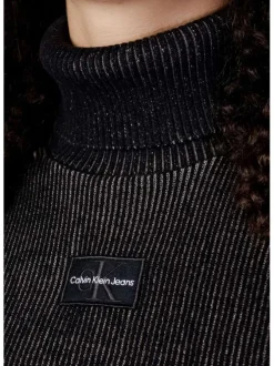Pull en coton mélangé sapin uni avec une coupe évasée, un col roulé et à manches longues