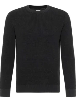 Pull en coton noir avec un col rond et des manches longues