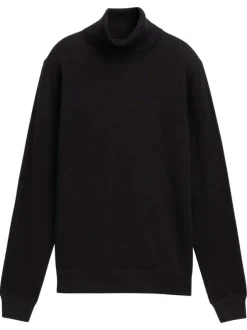 Pull en coton noir uni avec un col roulé et des manches longues