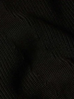 Pull en coton noir uni avec une coupe droite et un col camionneur