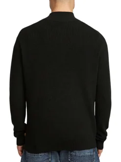 Pull en coton noir uni avec une coupe droite et un col camionneur