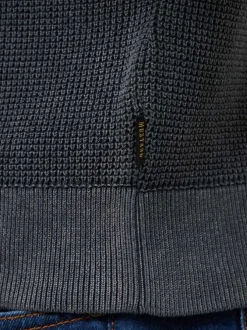 Pull en coton noir uni avec une coupe droite et un col rond