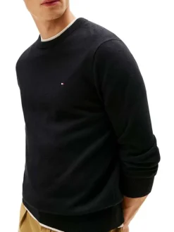 Pull en coton noir uni avec une coupe droite et un col rond