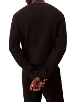 Pull en coton noir uni en maille avec un col rond et le mini logo brodé