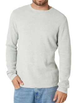 Pull en coton tilleul uni pourvu d'une coupe droite et d'un col rond