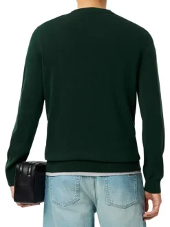 Pull en coton vert foncé avec un col rond et des manches longues