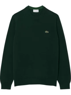 Pull en coton vert foncé avec un col rond et des manches longues