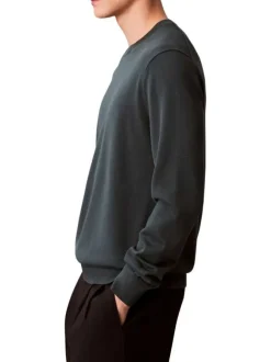 Pull en coton vert sapin uni avec une coupe droite et un col rond