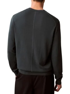 Pull en coton vert sapin uni avec une coupe droite et un col rond