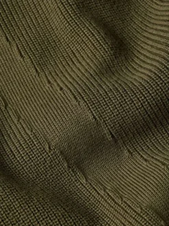 Pull en coton vert uni avec un col rond et un patch d'authenticité