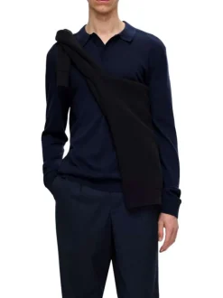 Pull en laine merinos marine uni avec une coupe droite et un col polo