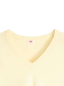 Pull jaune à coupe ajustée pourvu d'un col v et de manches longues