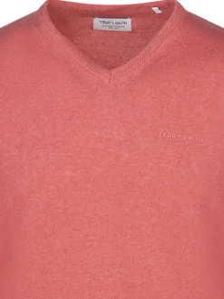 Pull manches longues en coton corail à maille jersey avec une coupe droite