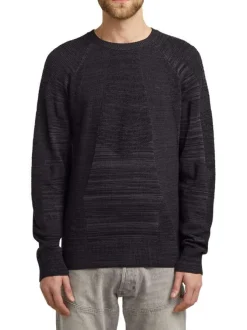 Pull noir uni avec des manches longues et une coupe droite à col rond