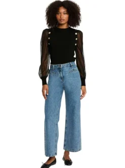 Pull noir uni à col rond pourvu de manches en tulle plumetis