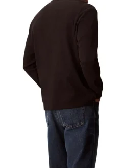 Pull noir uni texturé avec un petit patch brodé et à col rond