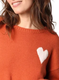 Pull orange avec un motif contrasté pourvu d'un col v et de manches longues