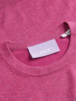 Pull rose uni coupe droite avec un col rond et des manches longues