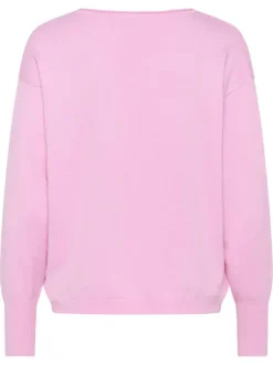 Pull rose uni pourvu d'une coupe droite et de manches longues