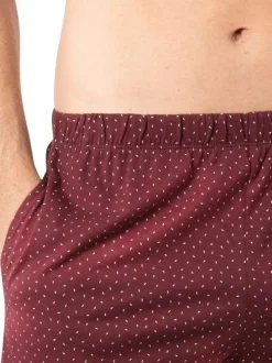 Pyjama court en coton bleu marine à col v avec des minis motifs sur le short