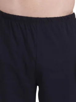 Pyjama court en coton bleu uni pourvu d'une coupe droite et d'un col rond