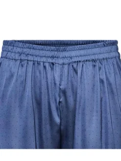 Pyjama long bleu à pois coupe droite fluide à col cranté et taille élastiquée