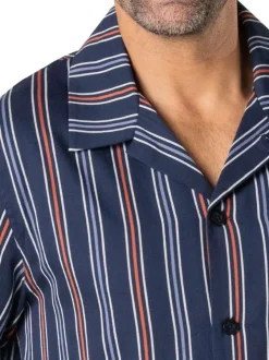 Pyjama long en coton bleu marine à rayures avec un col cubain et des poches