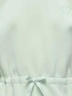Robe courte vert d'eau unie pourvue d'une coupe évasée et d'un col rond