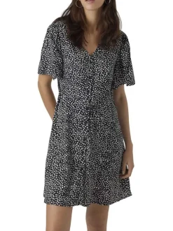 Robe courte noire à pois blancs boutonnée à coupe droite fluide et à col v