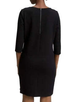 Robe courte noire unie avec un col rond et des manches longues