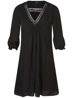 Robe courte noire unie avec une coupe droite à col v et des manches longues