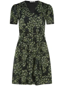 Robe courte verte mouchetée avec une coupe fluide et un col V