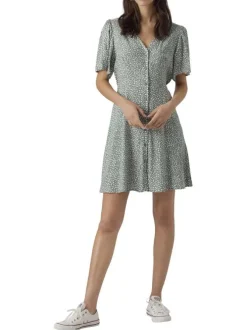 Robe courte verte ornée d'un motif à pois et pourvu d'un col v