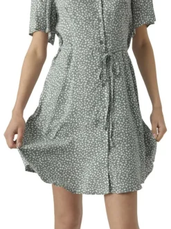 Robe courte verte ornée d'un motif à pois et pourvu d'un col v