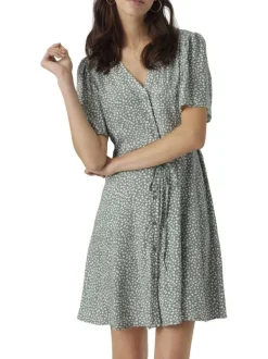 Robe courte verte ornée d'un motif à pois et pourvu d'un col v