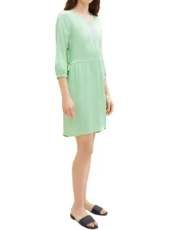 Robe courte verte unie avec une coupe ajustée un col v et des manche 3/4