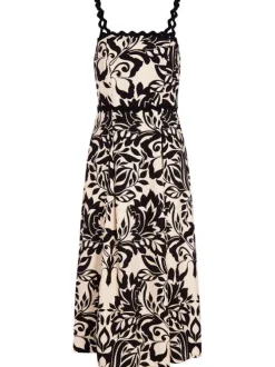 Robe longue beige et noire coupe cintrée pourvue de bretelles et d'un col carré