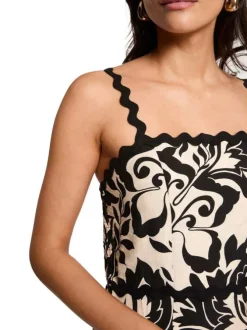 Robe longue beige et noire coupe cintrée pourvue de bretelles et d'un col carré
